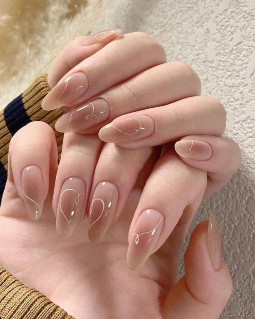 Diseños de uñas minimalistas nude románticos para el 14 de febrero 2026